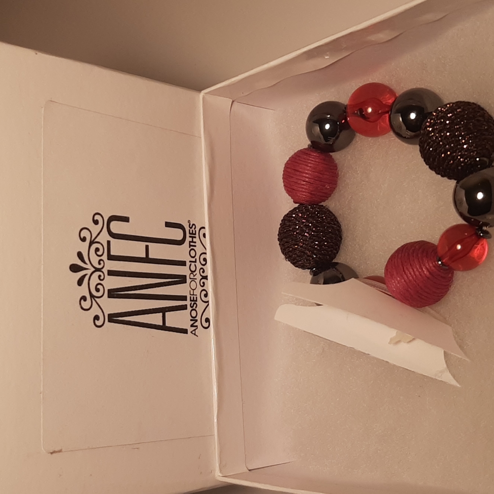 A pink and dark grey beaded bracelet